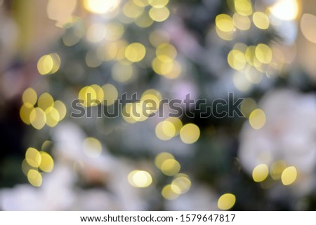 Abstract background lights and christmas toys. New Year and Christmas bokeh from burning lights and Christmas tree decorations.