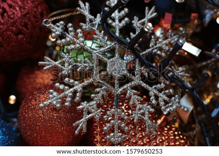 Christmas shiny background with a flickering garland, New Year's bright decor details macro photo