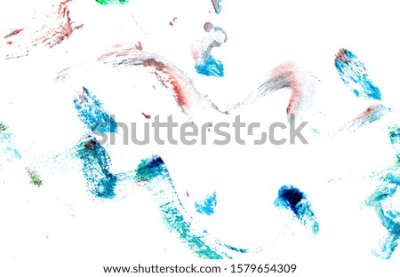 Paints on white paper as an abstract background.