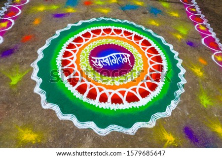 Traditional indian wedding ceremony in Hinduism :  Rangoli design translation for welcome 