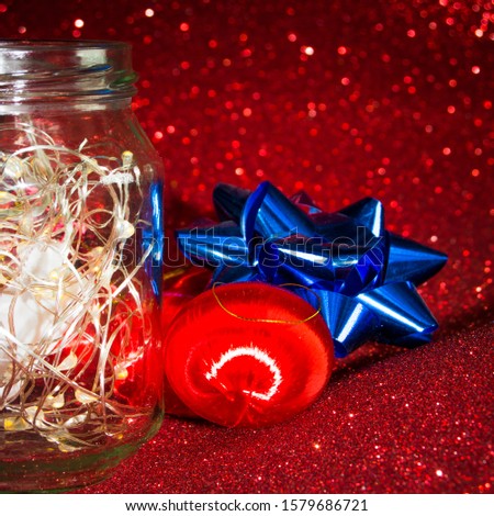 Christmas ornaments on red background with lights like stars