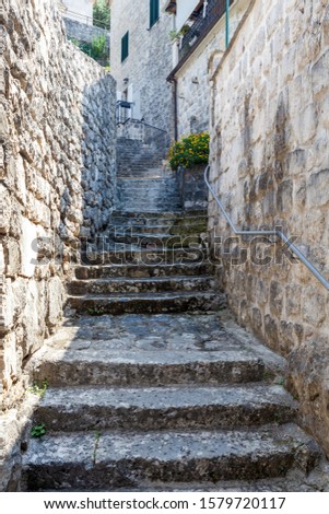 stone stairs on a narrow street in the town of Perast, Montenegro