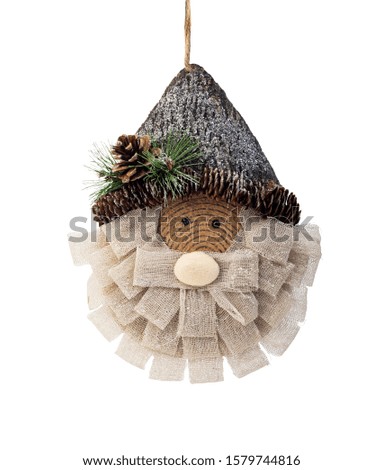 Wooden character of Santa Claus with ribbons decorated with pine isolated on white, Christmas decorative element of Santa Claus, Clipping path included 