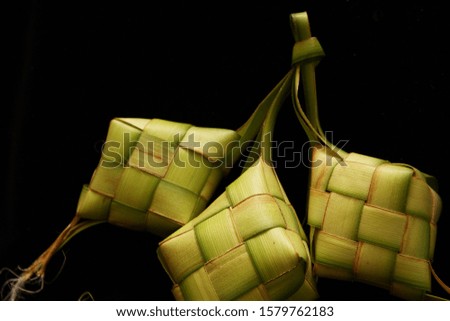Palm leaf pouch on black background