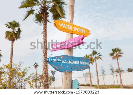 Beach pointer with directions to the sea and water sports