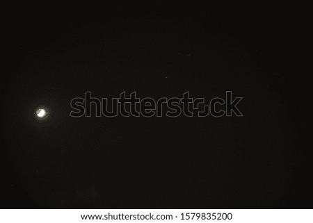 Moon in the Night Sky With Stars Trail