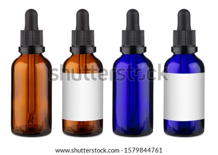 Set collection of blue and brown medicine glass pipette dropper bottle with blank copyspace label design pattern without isolated on white background Royalty-Free Stock Photo #1579844761