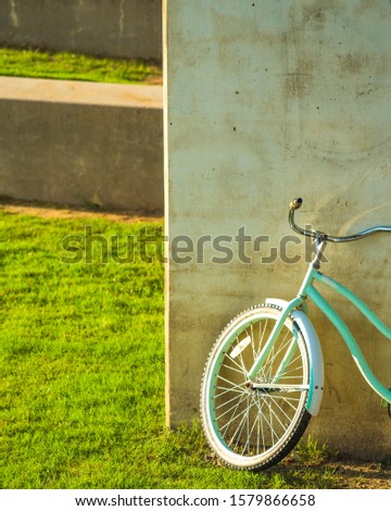 Bicycle stands near a concrete wall
