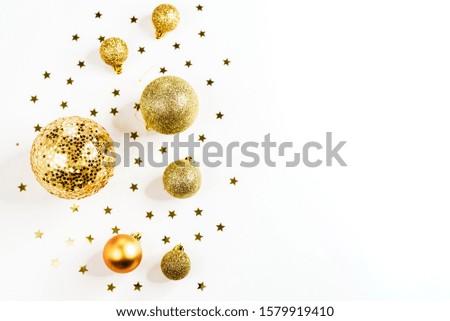 Gold Christmas balls top view, on a white background, ornament, flat lay