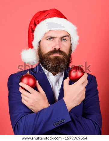 love xmas. man celebrate xmas. happy holidays. winter season fun. merry christmas. bearded man santa hat hold red xmas ball. be creative. mature event manager. businessman decorate new year tree.
