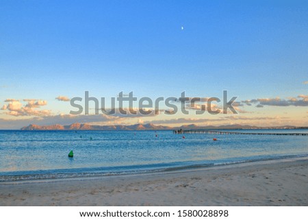 The photo was taken on the Spanish island - Palma de Mallorca. The picture shows an evening on the deserted beach of the island in the off-season.