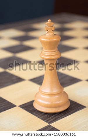 Close up of a king over the chessboard
