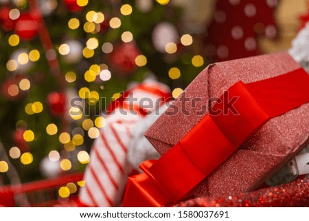 Christmas eve shopping mall sale advertising pattern picture gift box on Christmas tree garland lights bokeh illumination background empty copy space for your text here 