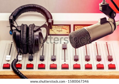 Professional microphone, sound mixer and headphones in radio station studio