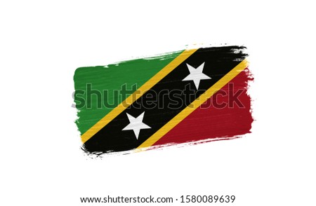 brush painted flag of Saint Kitts and Nevis isolated on white background