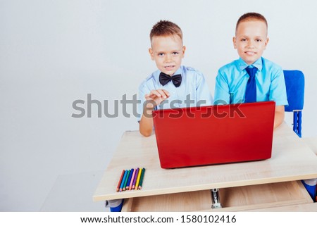 study on the computer two boys at school
