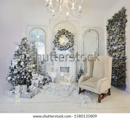Room decorated for Christmas or new year. The interior of the room with a Christmas tree and decorations for the holiday.