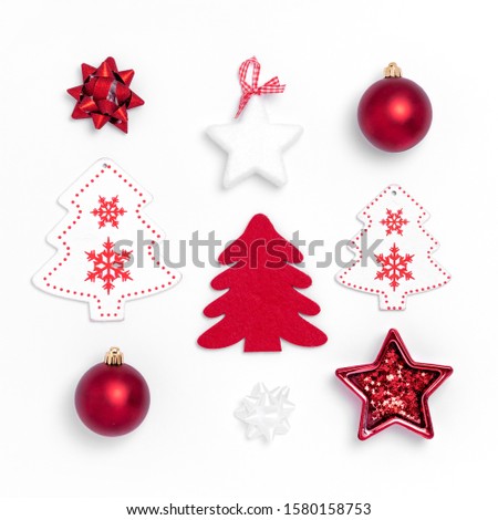 New Year and Christmas composition from red balls, white stars, chrismas tree, deer on white paper background. Top view, flat lay, copy space, square, from above, instagram Royalty-Free Stock Photo #1580158753