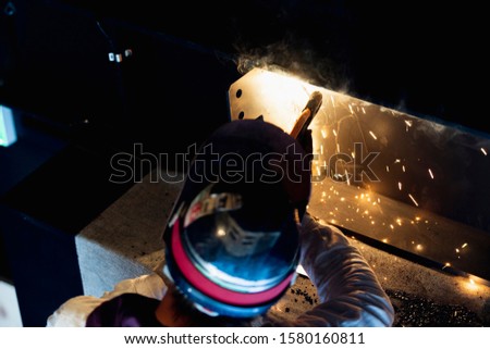 Craftsman doing welding work at construction site