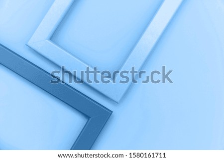 Simply design with empty two frame colored in trendy color of year 2020 Classic Blue background. Bright Macro color 19-4052. Top view, flat lay, copy space, mock up. Minimal concept.
