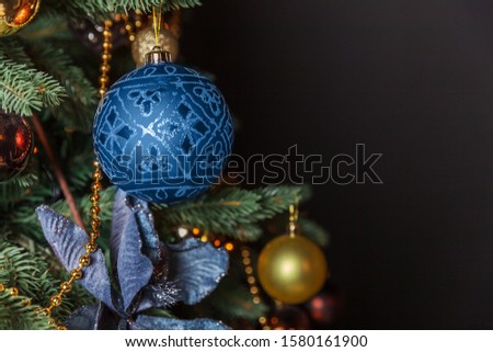 New Year 2020. Merry Christmas happy holidays. Classic Christmas decorated New Year tree with ornament decorations toy and ball colored in trendy color of year 2020 Classic Blue background.