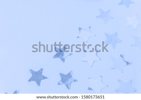 Classic blue festive background with stars. Color of the year 2020. Main color trend concept.