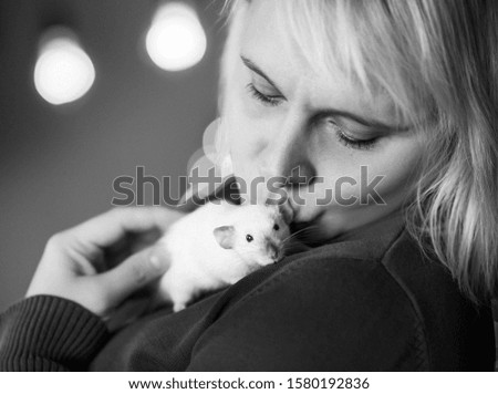 woman kissing close up her pet white rat new year 2020 symbol black and white photo