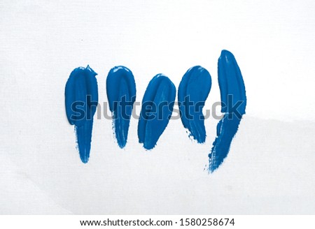 brush and blue paint texture on paper. color the year 2020 pantone classic blue