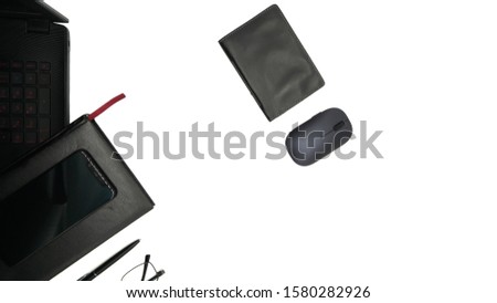 Isolated desktop top view. Working space. Office table. Notebook, glasses, pen, notebook. On white background. Minimalism, close-up of the workplace.                 