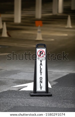 "Valet Parking. No Parking" sign in a reserved parking garage