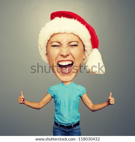 funny santa girl showing thumbs up and screaming