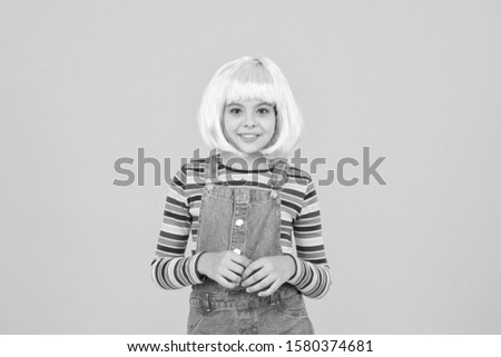 Otaku girl in wig smiling on yellow background. Cosplay character concept. Culture hobby and entertainment. Happy childhood. Anime fan. Cosplay kids party. Child cute cosplayer. Cosplay outfit.