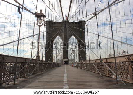 NEW YORK - JUNE 2: Views of the Brooklyn Bridge on a summer day on June 2, 2015. Its a famous and iconic bridge in New York, which passes the east river.