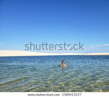 woman in a lagoo and sand