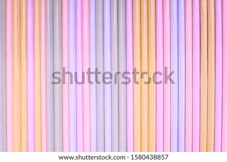 Abstract background of vertical colored stripes. Bed tones.