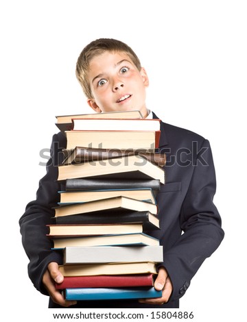 The boy and a pile of books on a white background. Concept for "Back to school"