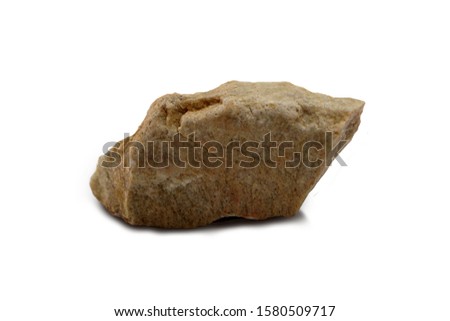 Quartzite rock isolated on white background. Quartzite is a hard, non-foliated metamorphic rock which was originally pure quartz sandstone. There is noise and grain caused by the texture of the stone. Royalty-Free Stock Photo #1580509717
