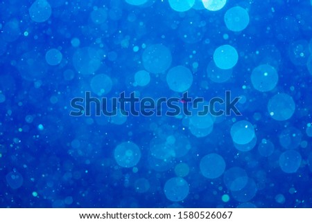 Abstract Blue bokeh defocus by neon lights blur background.