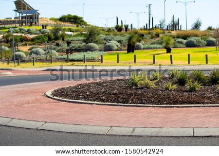Scenic panoramic approach to Ocean Beach Bunbury Western Australia from the roundabout leading to Ocean Drive on a fine sunny afternoon in mid summer with landscaped gardens on one side.