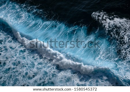 Aerial view to waves in ocean Splashing Waves. Blue clean wavy sea water. Royalty-Free Stock Photo #1580545372