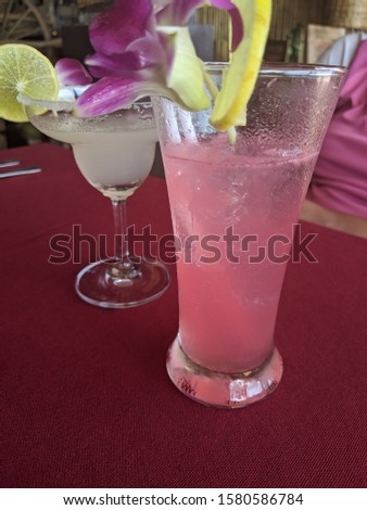 Two cocktails - a Singapore Sling and a Margarita 