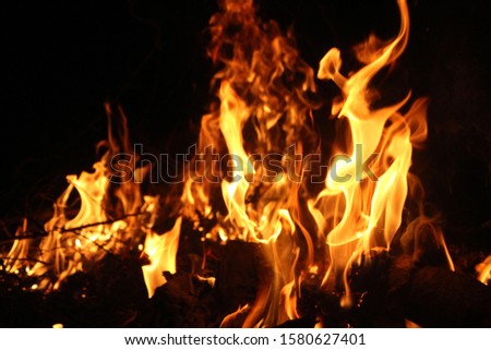 Natural red fire that burns naturally Thermal power Dark night On a black background