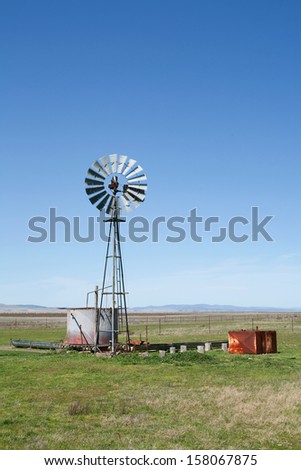 View of an Australian Windmill situated in a farm paddock