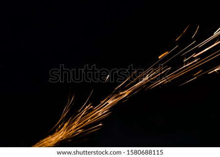 worker cuts a metal pipe by means of the abrasive tool