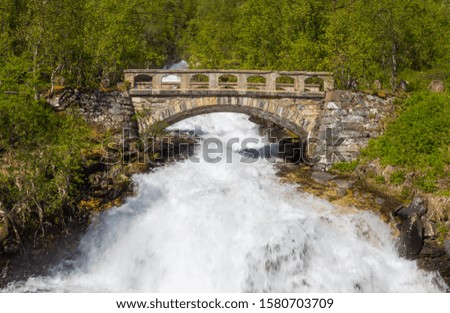 old stone bridge over river 