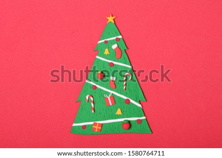 a handmade clay sculpture Christmas tree with ornaments