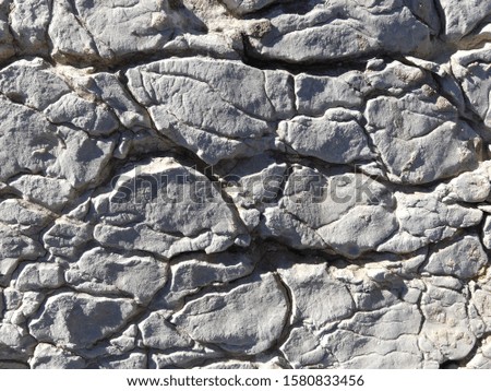 A texture of rock with lot of cracks