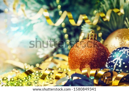 Vintage card. Colorful Christmas decorations on the background of fir branches
