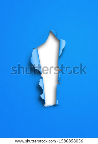 Blue torn paper with hole. blank background template