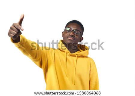 young black man in yellow hoodie in glasses